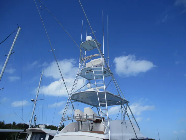 Barratuna Yacht Photos Pics Custom Carolina 53 Sculley 2008 yacht tower against blue sky with clouds.