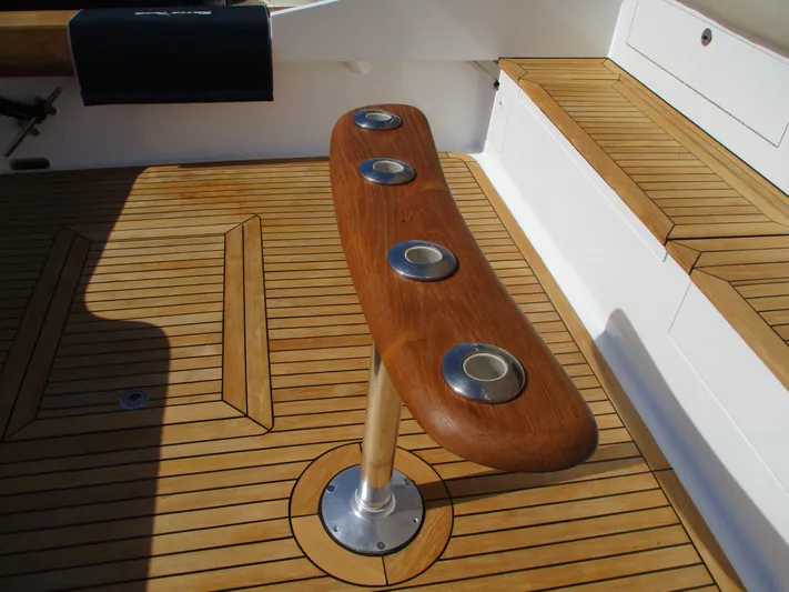 Barratuna Yacht Photos Pics Teak deck of 2008 Custom Carolina 53 Sculley with rod holders.