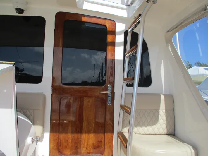 Barratuna Yacht Photos Pics Interior of 2008 Custom Carolina 53 Sculley with wooden door and ladder.