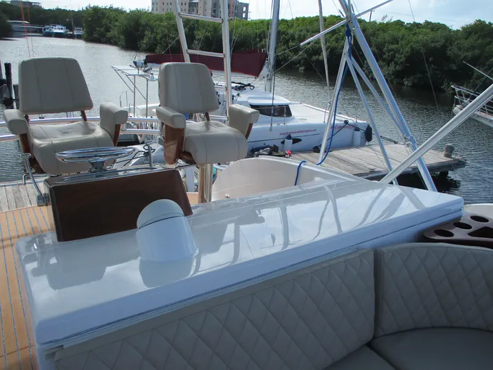 Barratuna Yacht Photos Pics 2008 Custom Carolina 53 Sculley yacht interior with seating and helm chairs at dock.