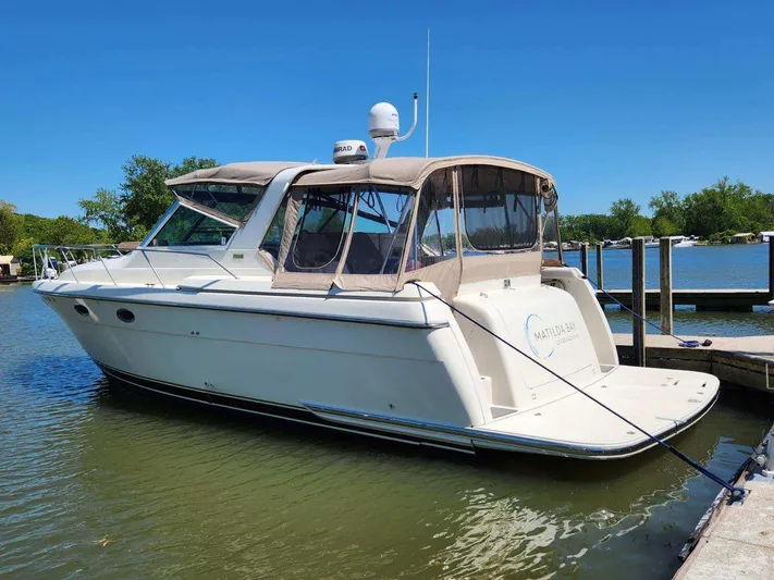 Matilda Bay Yacht Photos Pics 1997 Tiara Yachts 3500 Express docked on a sunny day, featuring a sleek design.