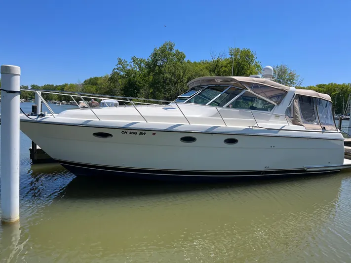 Matilda Bay Yacht Photos Pics 1997 Tiara Yachts 3500 Express docked in a serene marina setting.