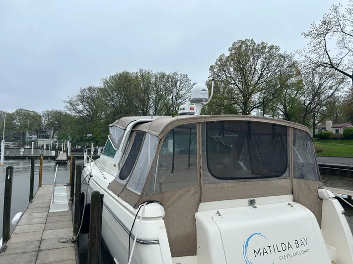 Matilda Bay Yacht Photos Pics 1997 Tiara Yachts 3500 Express docked, featuring a beige canopy and "Matilda Bay" branding.