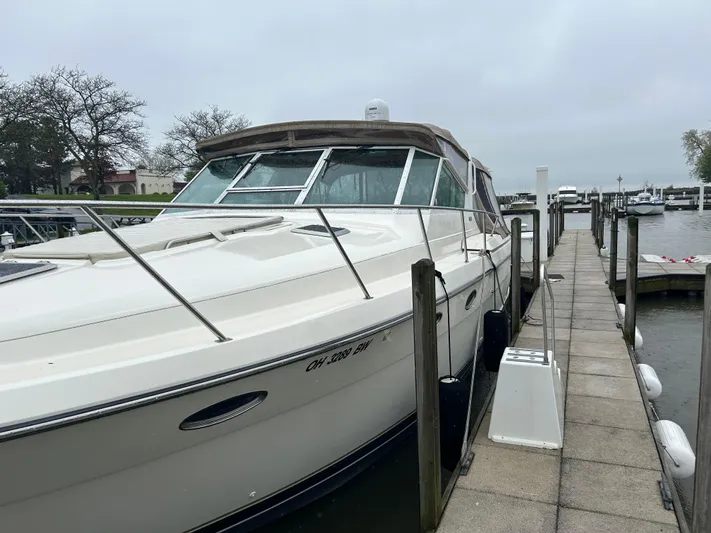 Matilda Bay Yacht Photos Pics 1997 Tiara Yachts 3500 Express docked at marina on a cloudy day.