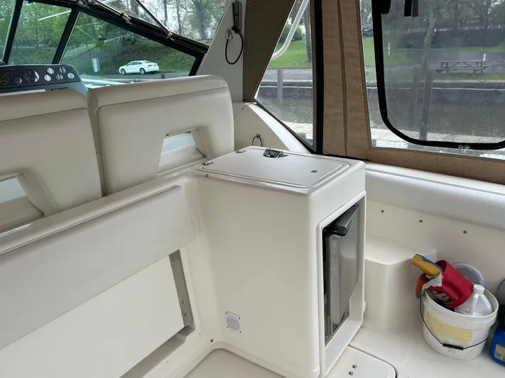 Matilda Bay Yacht Photos Pics 1997 Tiara Yachts 3500 Express interior with seating and mini fridge.