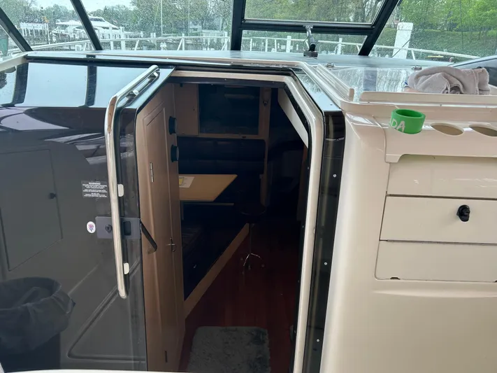 Matilda Bay Yacht Photos Pics 1997 Tiara Yachts 3500 Express cabin entrance with open door and interior view.