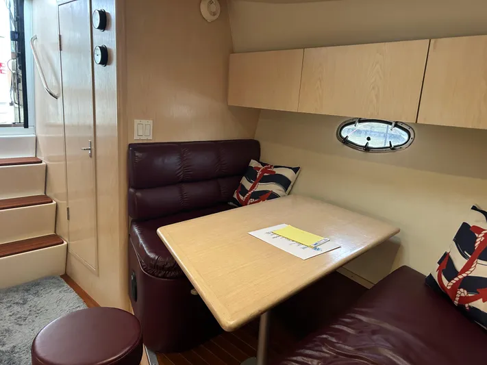 Matilda Bay Yacht Photos Pics Interior of 1997 Tiara Yachts 3500 Express with cozy seating and table.