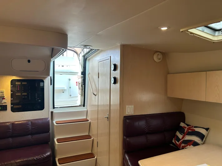 Matilda Bay Yacht Photos Pics Interior of 1997 Tiara Yachts 3500 Express, featuring seating, stairs, and nautical decor.