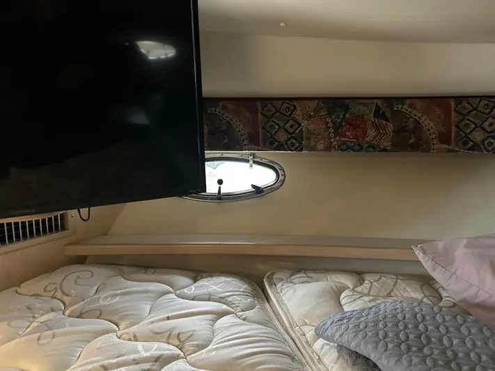 Matilda Bay Yacht Photos Pics Interior cabin of 1997 Tiara Yachts 3500 Express with bed and TV.