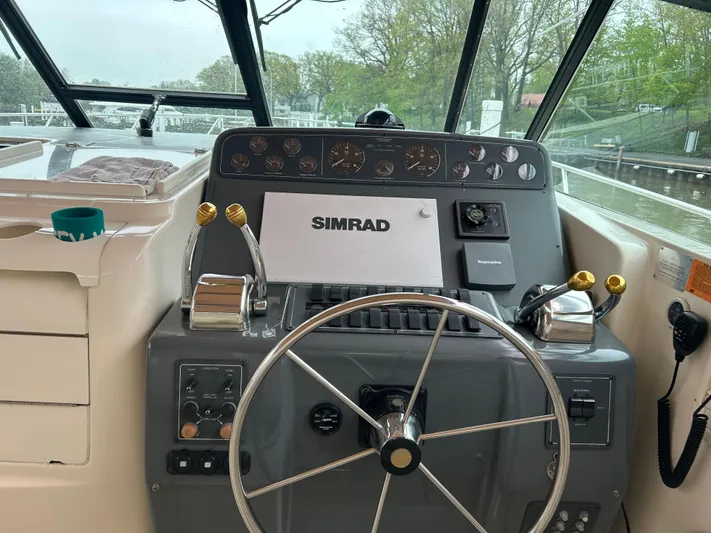 Matilda Bay Yacht Photos Pics 1997 Tiara Yachts 3500 Express helm with Simrad navigation system and dual throttle controls.