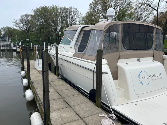 Matilda Bay Yacht Photos Pics 1997 Tiara Yachts 3500 Express docked, featuring a sleek white exterior and covered cockpit.