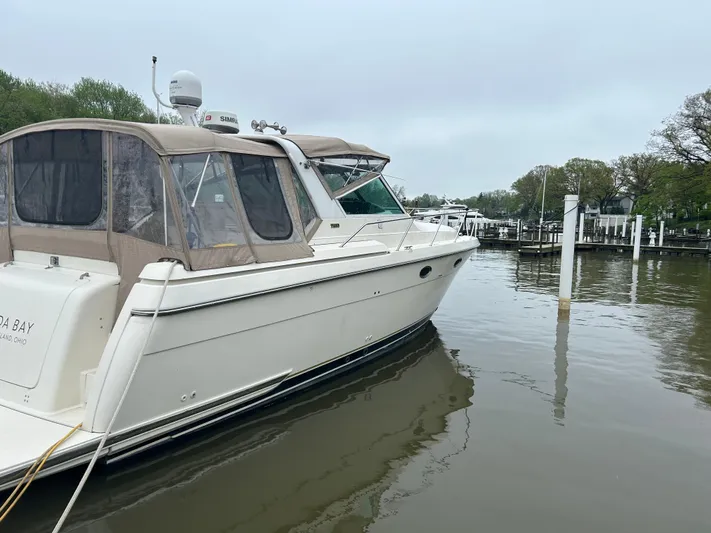 Matilda Bay Yacht Photos Pics 1997 Tiara Yachts 3500 Express docked in a serene marina setting.