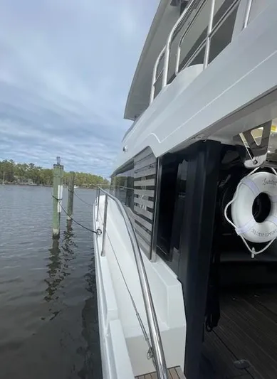 Sweetest Southern Comfort Yacht Photos Pics Beneteau ST48 yacht docked by a serene lake, 2022 model.