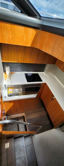  Yacht Photos Pics Modern kitchen area in 2018 Sunseeker Predator yacht with wooden cabinetry.