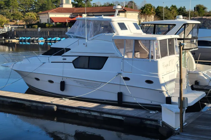 Escape II Sea Yacht Photos Pics 2003 Silverton 453 Motor Yacht docked at marina, clear day, calm water.