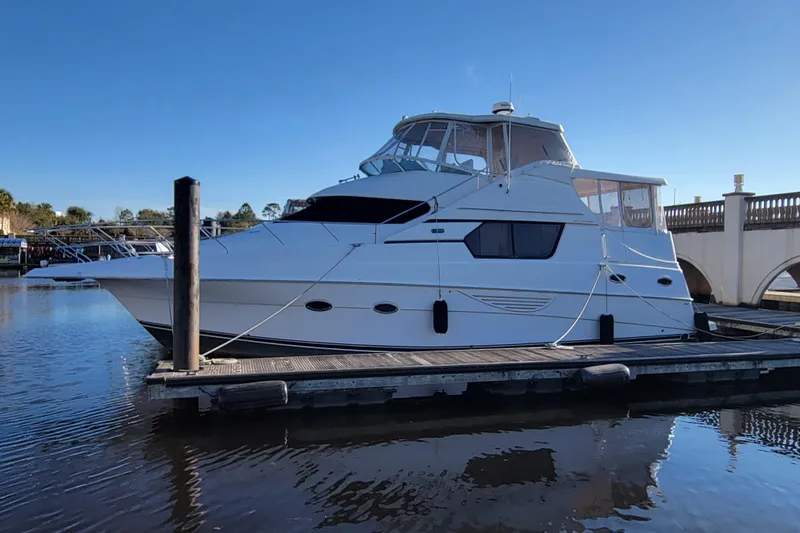 Escape II Sea Yacht Photos Pics 2003 Silverton 453 Motor Yacht docked at marina under clear blue sky.