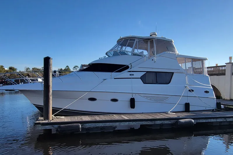 Escape II Sea Yacht Photos Pics 2003 Silverton 453 Motor Yacht docked on a sunny day.