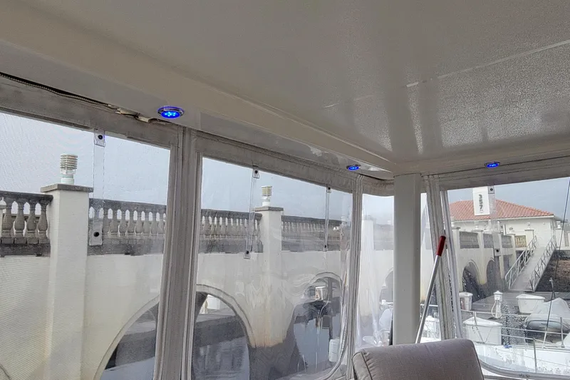 Escape II Sea Yacht Photos Pics Interior view of 2003 Silverton 453 Motor Yacht with blue LED lights and marina backdrop.