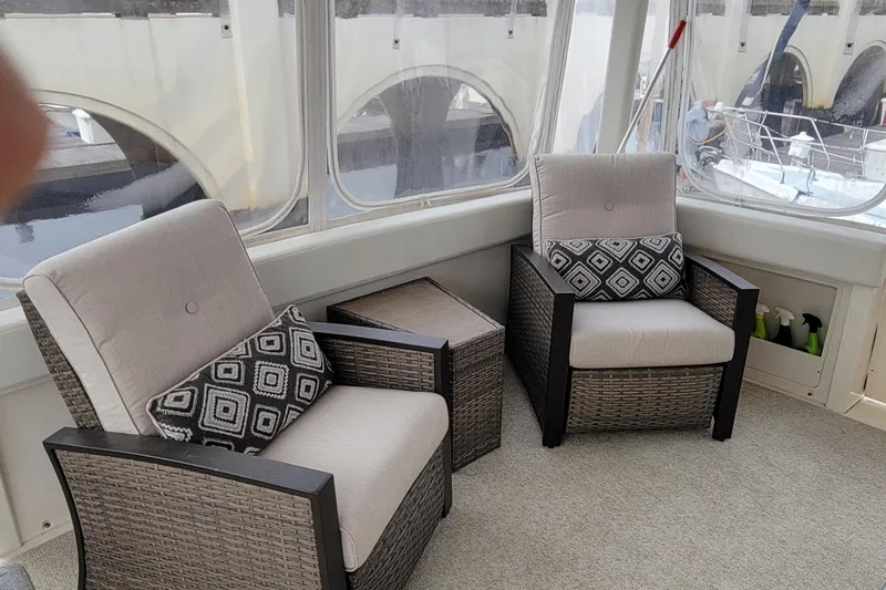 Escape II Sea Yacht Photos Pics 2003 Silverton 453 Motor Yacht interior with wicker chairs and geometric cushions.