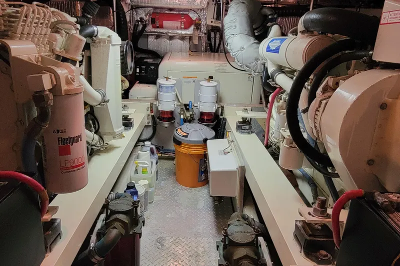 Escape II Sea Yacht Photos Pics Engine room of a 2003 Silverton 453 Motor Yacht, featuring various mechanical components.
