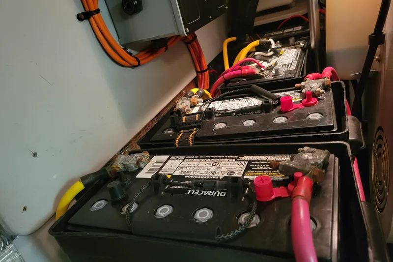 Escape II Sea Yacht Photos Pics Battery compartment of a 2003 Silverton 453 Motor Yacht with connected cables.