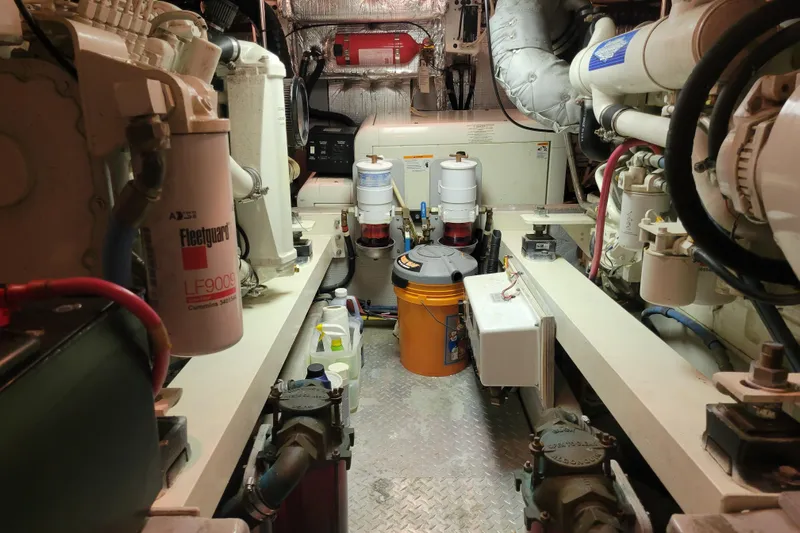 Escape II Sea Yacht Photos Pics Engine room of a 2003 Silverton 453 Motor Yacht, featuring mechanical components and filters.