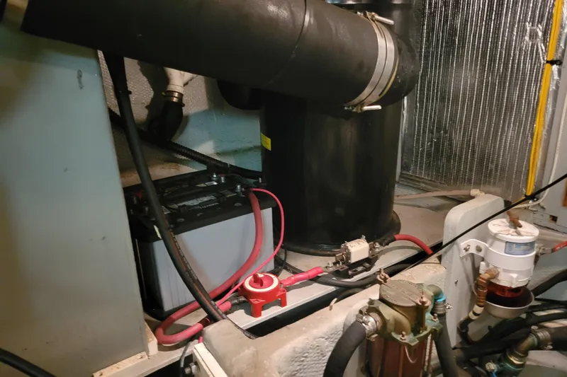 Escape II Sea Yacht Photos Pics Engine room of a 2003 Silverton 453 Motor Yacht, featuring battery and piping systems.