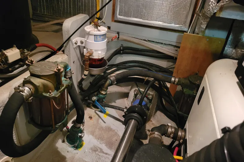 Escape II Sea Yacht Photos Pics Engine room of 2003 Silverton 453 Motor Yacht with visible hoses and components.