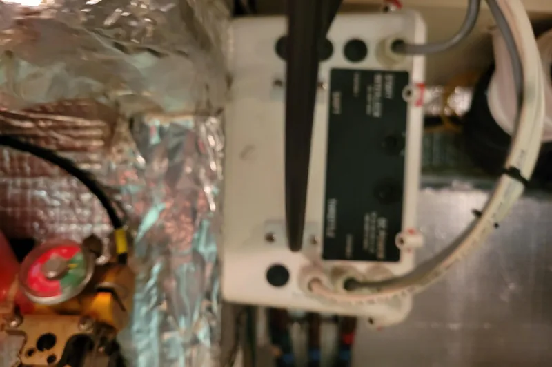 Escape II Sea Yacht Photos Pics Engine room of 2003 Silverton 453 Motor Yacht with control panel and wiring.