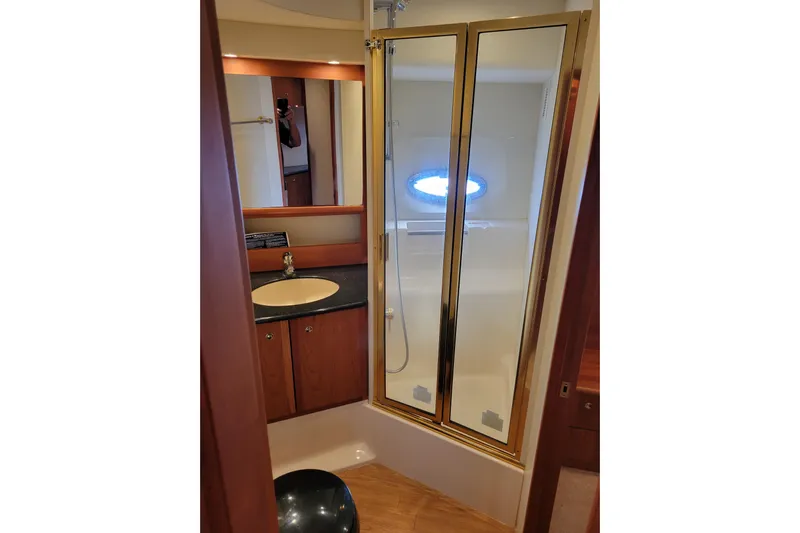 Escape II Sea Yacht Photos Pics Luxurious bathroom in 2003 Silverton 453 Motor Yacht with shower and vanity.