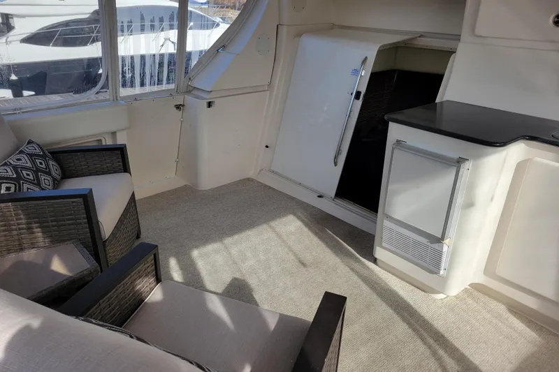 Escape II Sea Yacht Photos Pics Interior of 2003 Silverton 453 Motor Yacht with seating and kitchenette area.