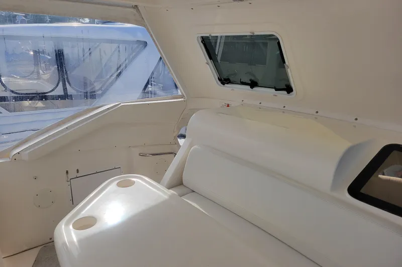 Escape II Sea Yacht Photos Pics Interior view of 2003 Silverton 453 Motor Yacht with seating and window.