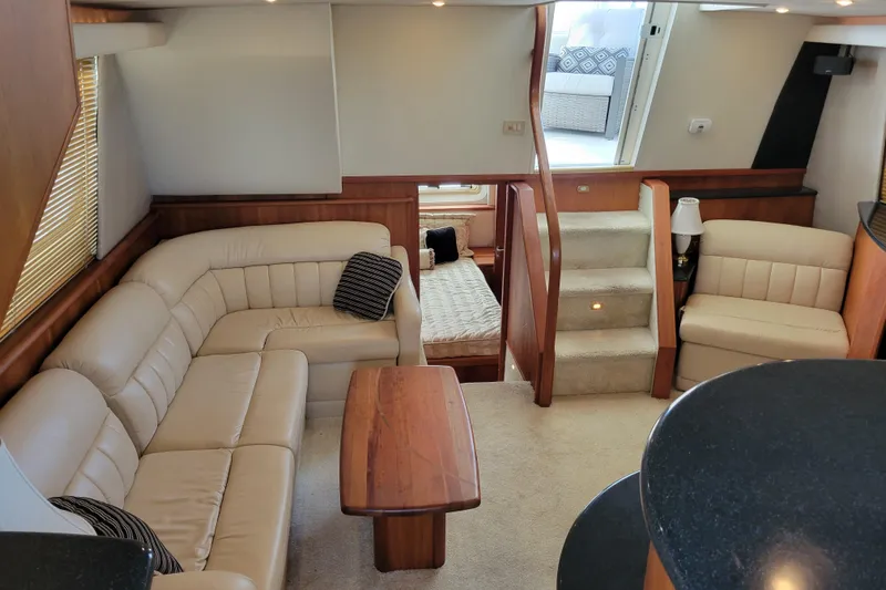 Escape II Sea Yacht Photos Pics Luxurious interior of 2003 Silverton 453 Motor Yacht with beige leather seating and wooden accents.