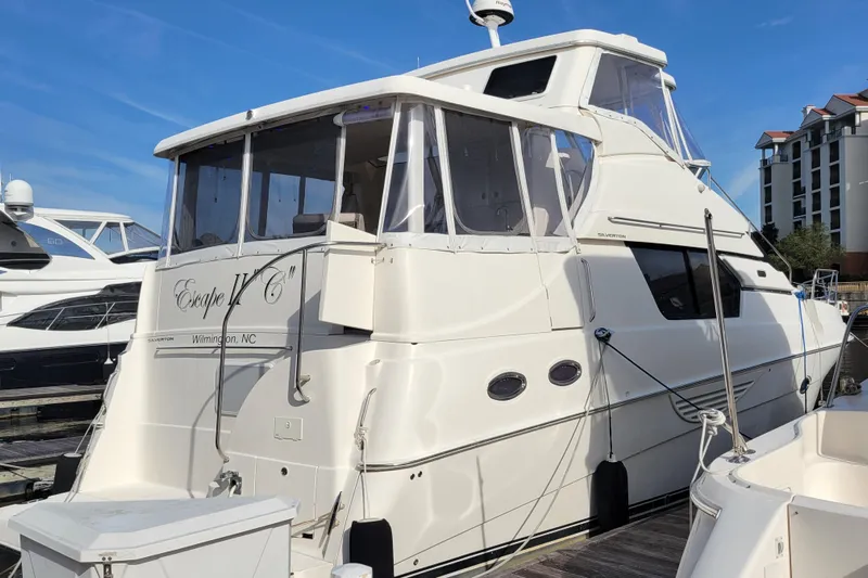 Escape II Sea Yacht Photos Pics 2003 Silverton 453 Motor Yacht docked, featuring sleek design and spacious upper deck.