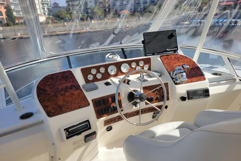 Escape II Sea Yacht Photos Pics 2003 Silverton 453 Motor Yacht helm with steering wheel and navigation instruments.