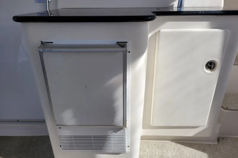 Escape II Sea Yacht Photos Pics 2003 Silverton 453 Motor Yacht interior with built-in storage and countertop.