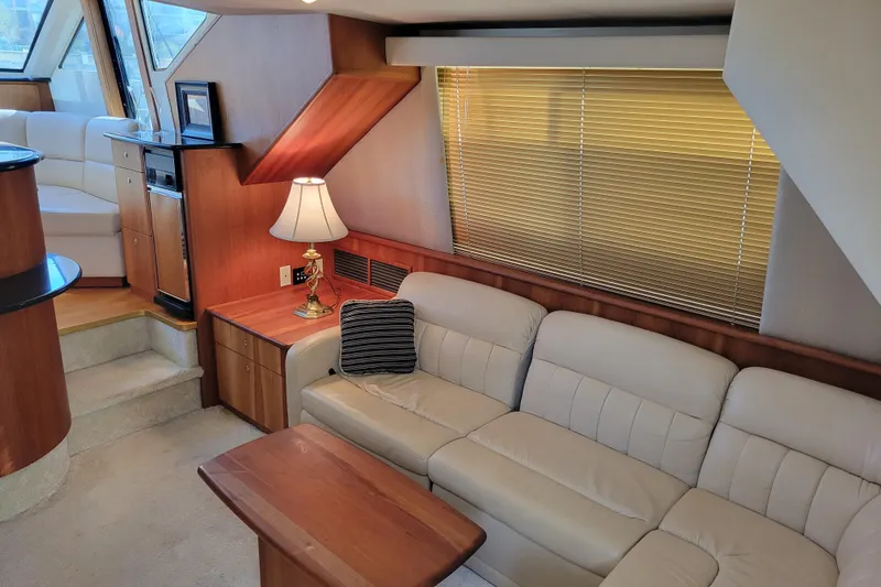 Escape II Sea Yacht Photos Pics Interior of 2003 Silverton 453 Motor Yacht with beige leather seating and wooden accents.