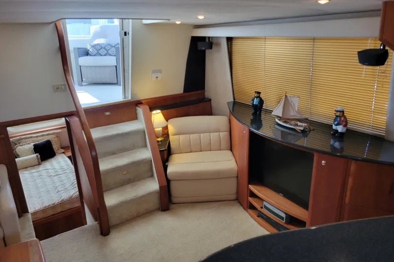Escape II Sea Yacht Photos Pics Interior of 2003 Silverton 453 Motor Yacht with cozy seating and nautical decor.