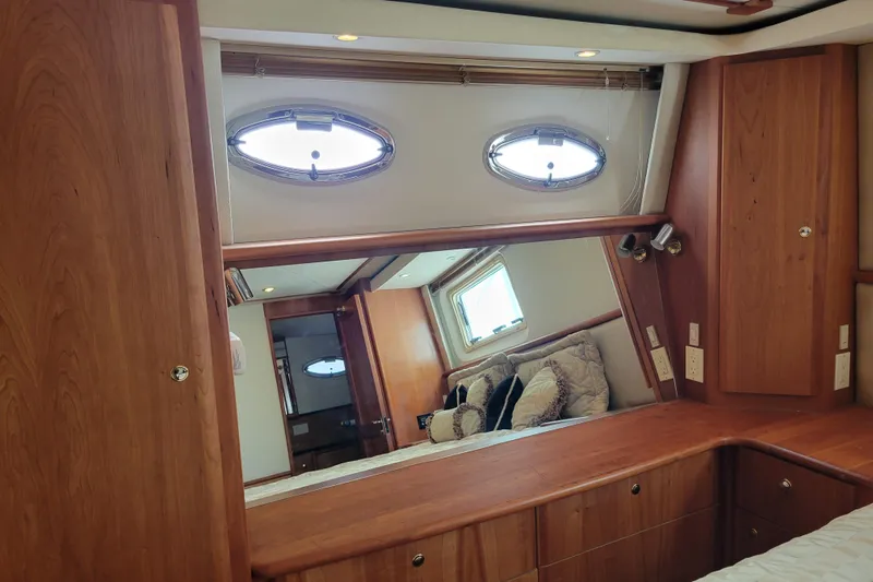 Escape II Sea Yacht Photos Pics Interior of 2003 Silverton 453 Motor Yacht with wooden cabinetry and porthole windows.