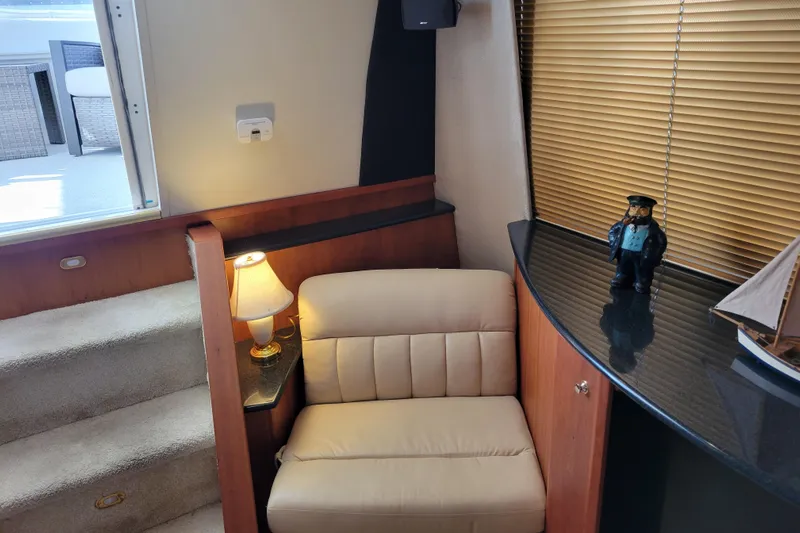 Escape II Sea Yacht Photos Pics Interior of 2003 Silverton 453 Motor Yacht with chair, lamp, and nautical decor.
