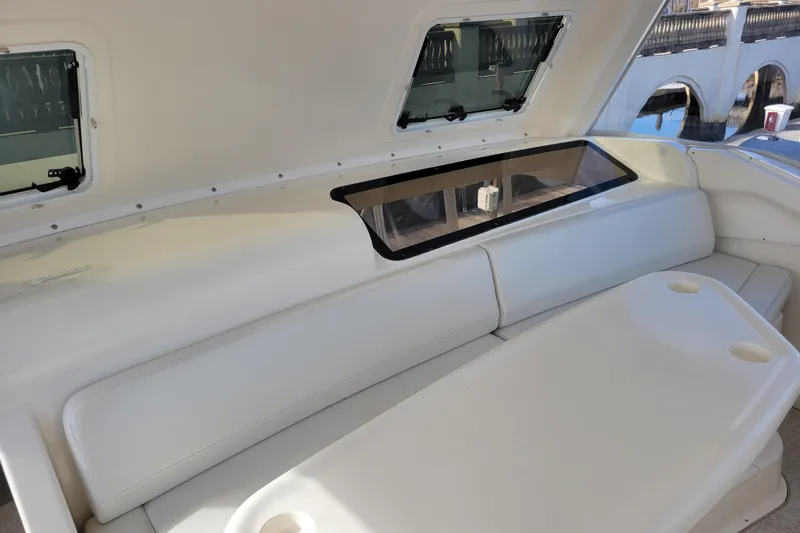 Escape II Sea Yacht Photos Pics 2003 Silverton 453 Motor Yacht interior with white seating and table.