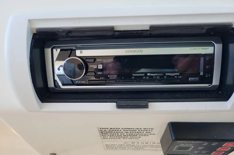 Escape II Sea Yacht Photos Pics Kenwood stereo system in 2003 Silverton 453 Motor Yacht dashboard.