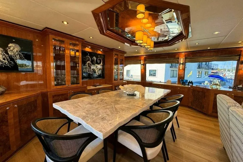 Cynderella Yacht Photos Pics Luxurious dining area on 2010 Hargrave Custom Raised Pilothouse yacht with elegant wood finishes.