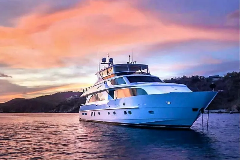 Cynderella Yacht Photos Pics Luxurious 2010 Hargrave Custom Raised Pilothouse yacht at sunset on serene waters.
