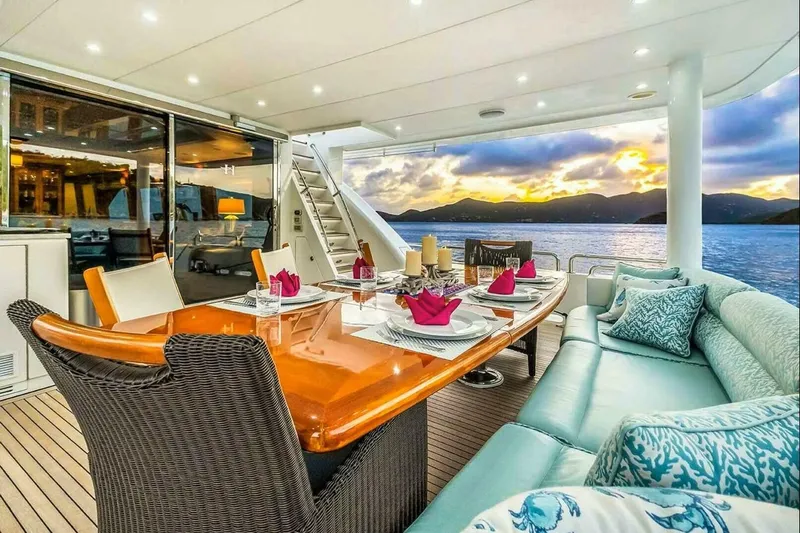 Cynderella Yacht Photos Pics Luxurious 2010 Hargrave Custom Raised Pilothouse yacht dining area with ocean sunset view.
