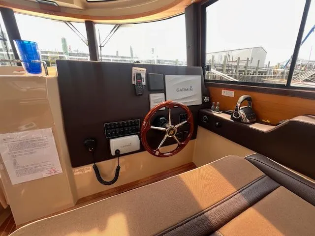 Windless Yacht Photos Pics Interior helm of 2016 Ranger Tugs R-29 S Tug with Garmin navigation system.