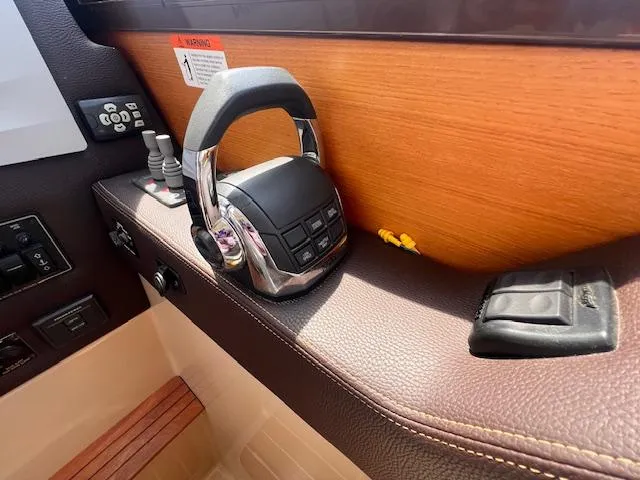 Windless Yacht Photos Pics 2016 Ranger Tugs R-29 S Tug interior controls with wood and leather accents.