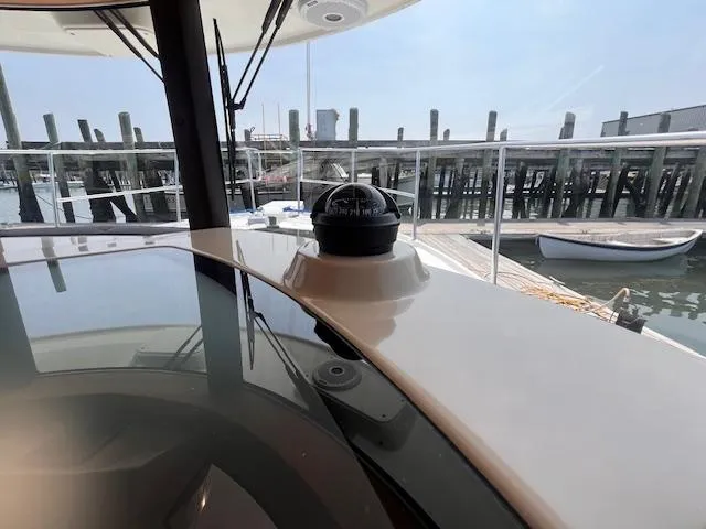 Windless Yacht Photos Pics Interior view of 2016 Ranger Tugs R-29 S Tug with compass, docked at marina.