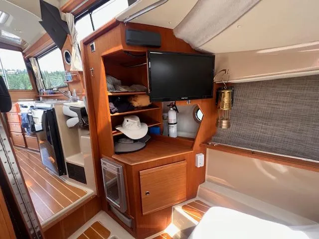 Windless Yacht Photos Pics Interior of 2016 Ranger Tugs R-29 S Tug with wood finish and modern amenities.