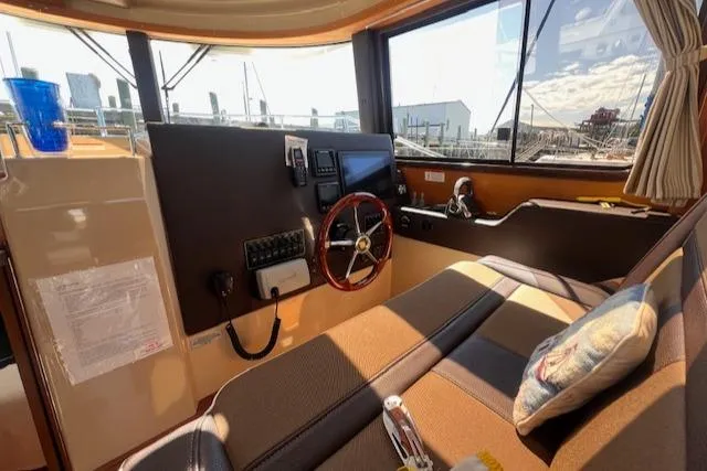 Windless Yacht Photos Pics Interior of 2016 Ranger Tugs R-29 S Tug, featuring helm and seating area.
